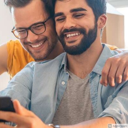 Two men smiling
