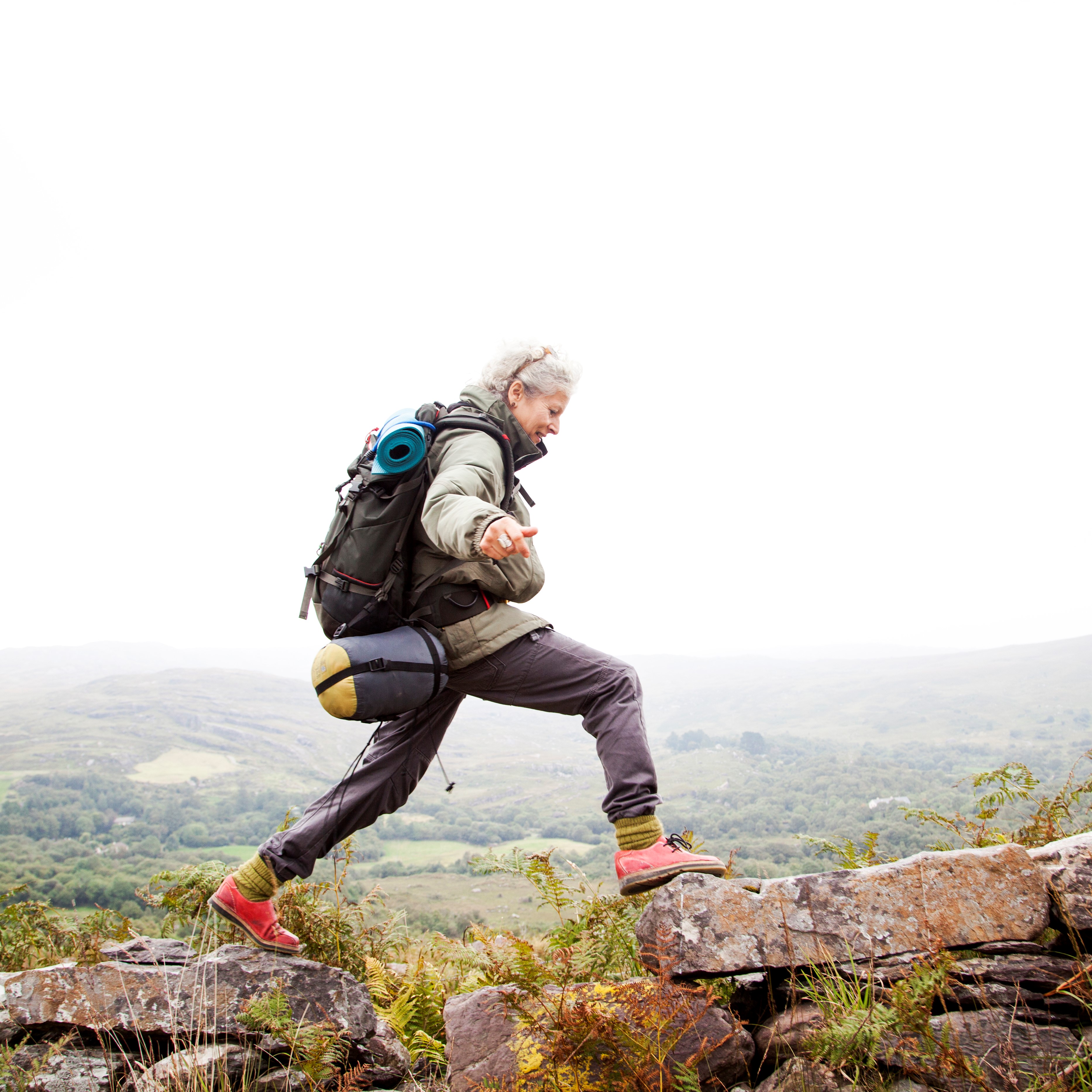 Woman hiking in the mountains of Ireland