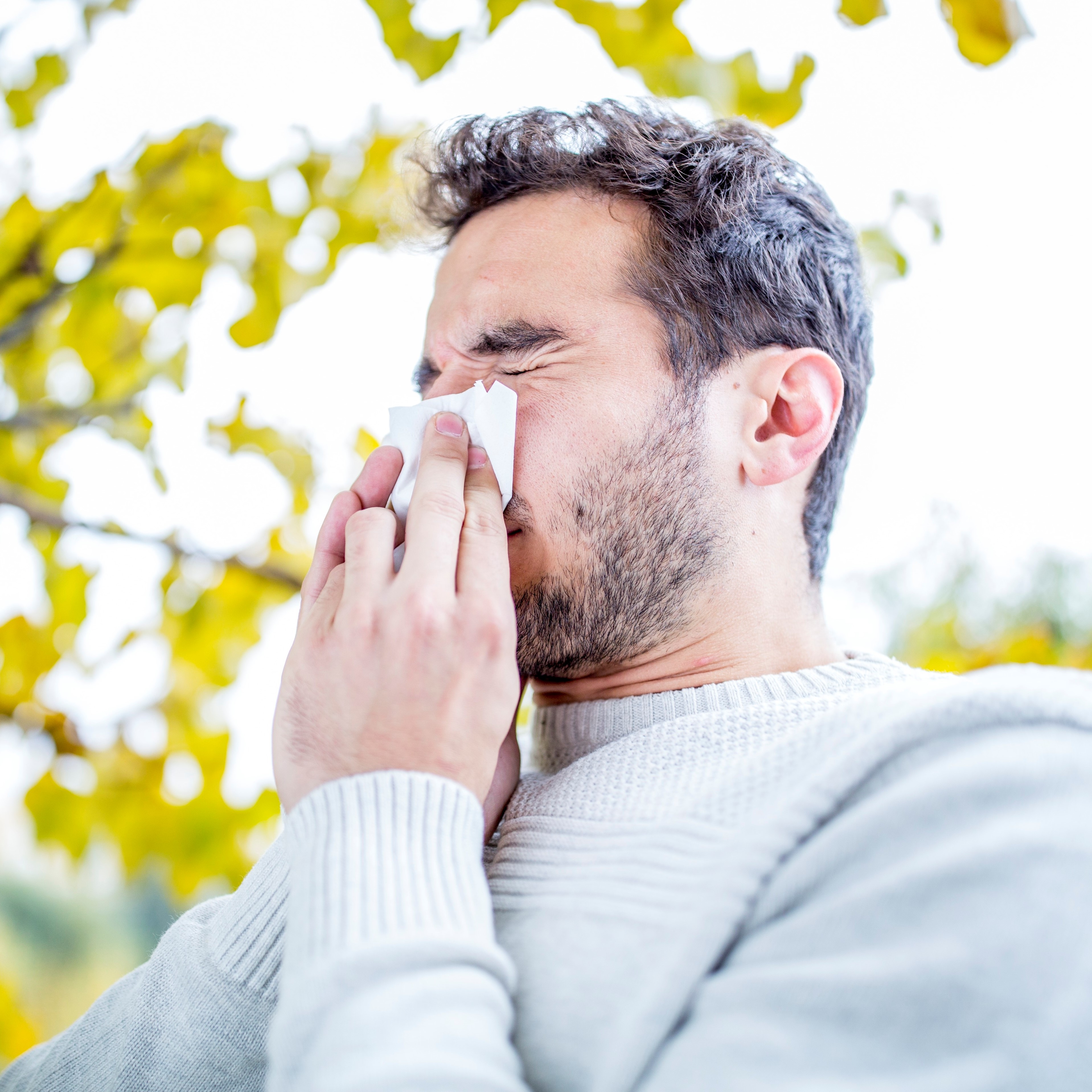 Man sneezing - allergies