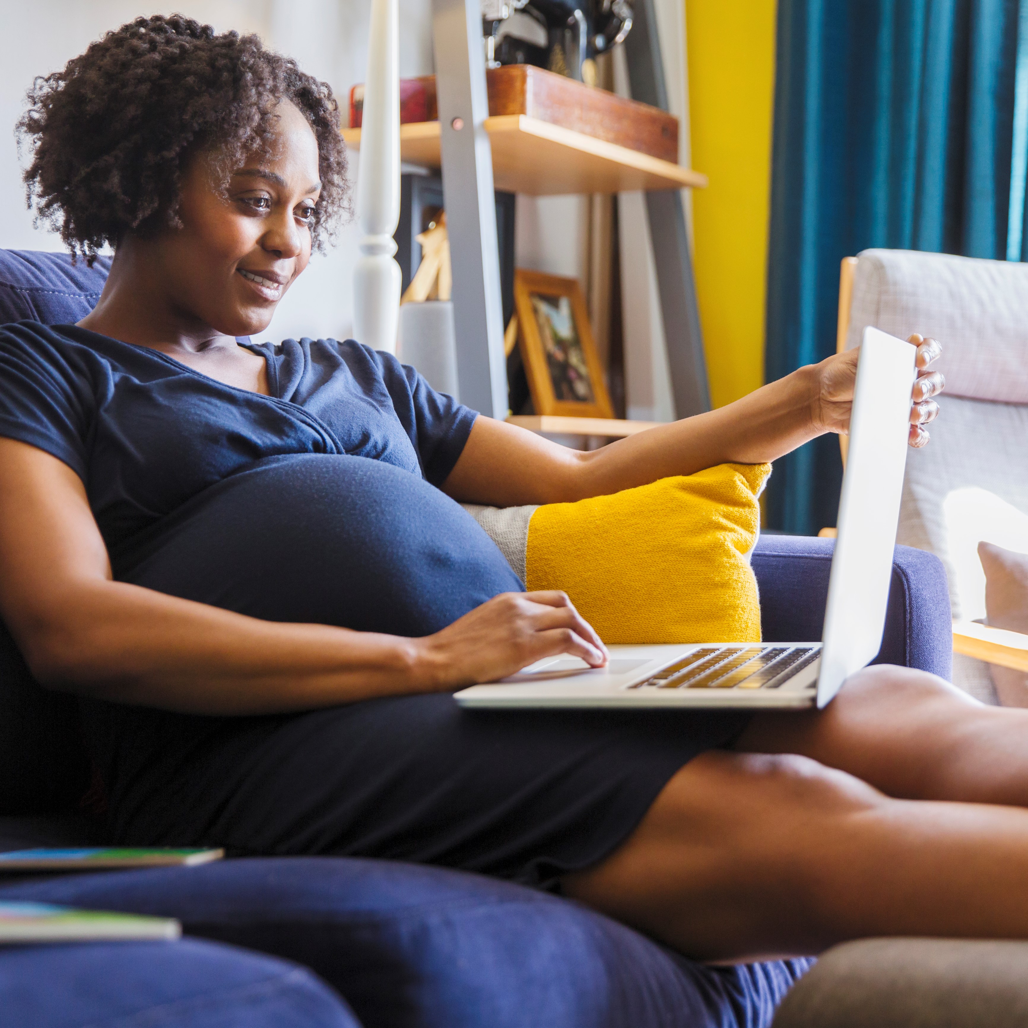 Pregnant woman on computer